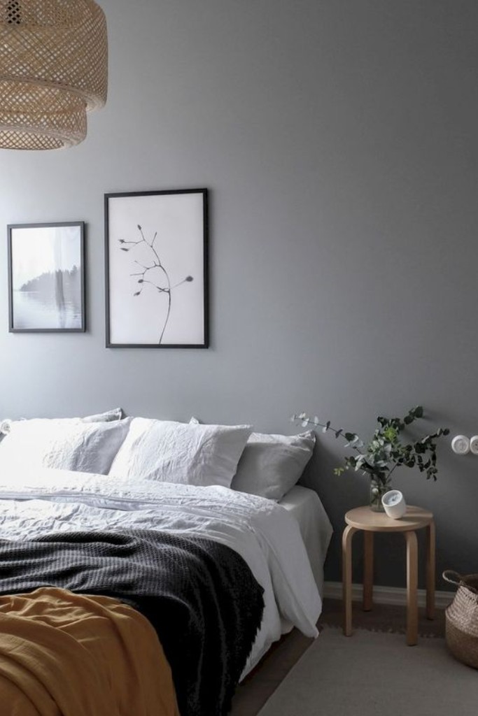grey-bedroom-with-hanging-artworks